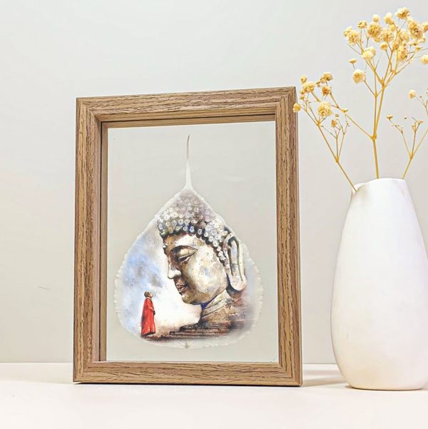 Buddha portrait printed on a real Bodhi leaf in a small wood desk frame